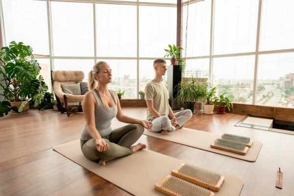 young-serene-couple-in-sportswear-sitting-in-pose-of-lotus-and-meditating.jpg young-serene-couple-in-sportswear-sitting-in-pose-of-lotus-and-meditating.jpg
